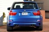 2013 BMW X5 M in Monte Carlo Blue Metallic from a rear view